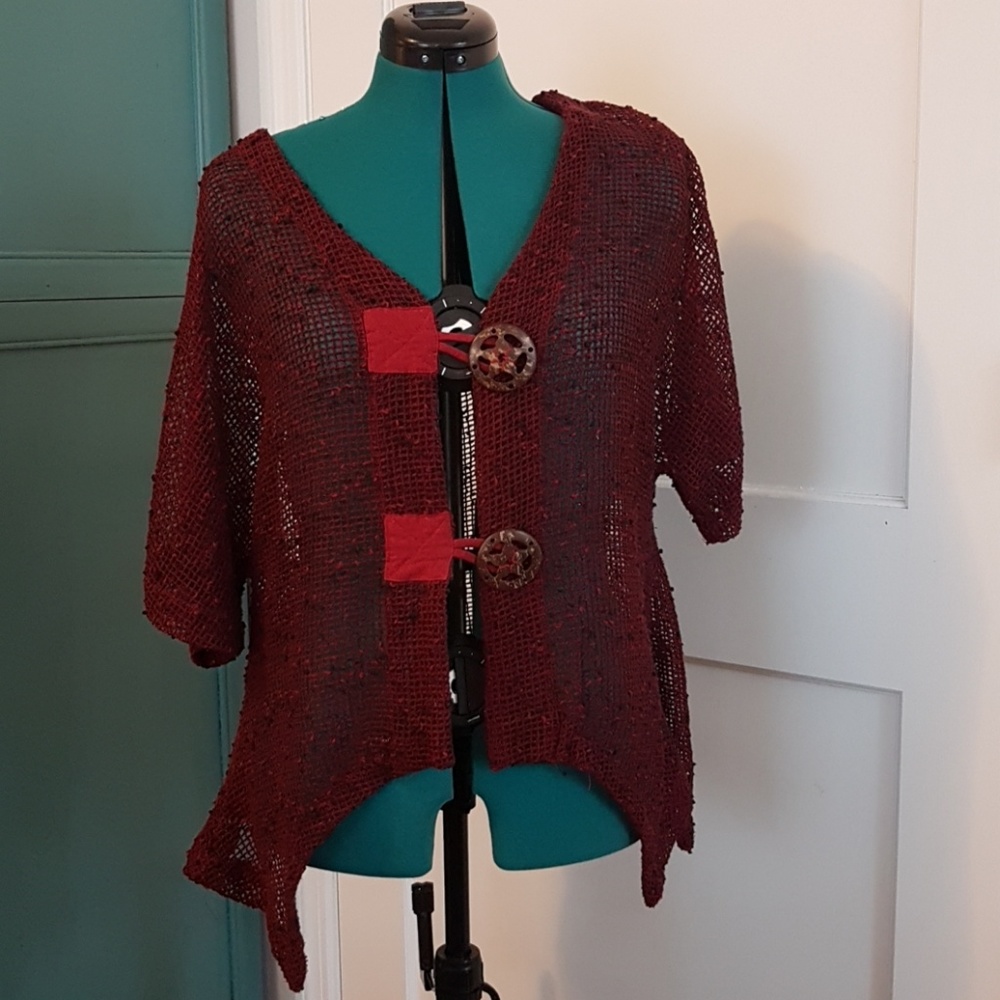 Red mesh vest with super decorative buttons.